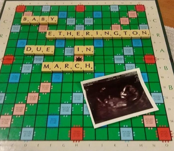 birth announcement on a scrabble board