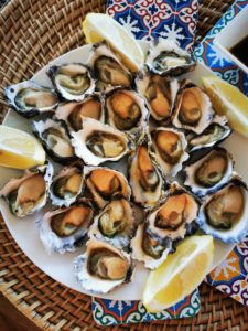 Sydney rock oysters on a plate with fresh lemon
